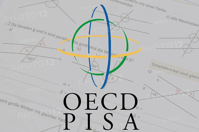 (photo montage) Logo of the PISA study against the background of a mathematics textbook