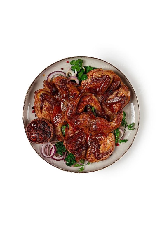 Fried, quail meat, tobacco (tapaka), with spices, on a white background, isolate, homemade, no people