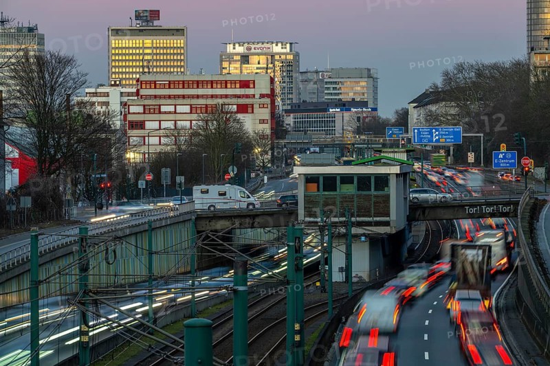 Motorway A40, Ruhr expressway, heavy traffic jam, rush hour, city passage in Essen, skyline of the city centre, underground line between the lanes, Hobeisenbrücke stop, North Rhine-Westphalia, Germany