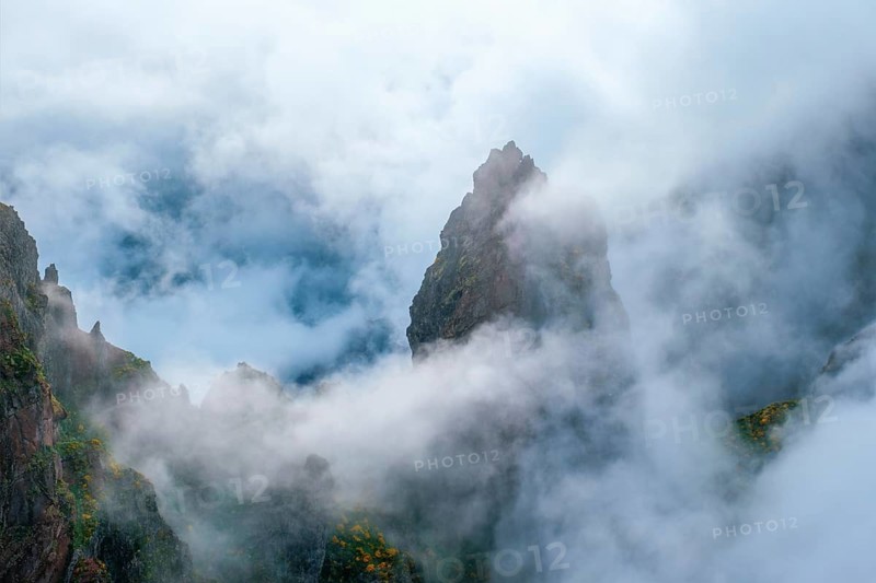 A mountain covered in fog and clouds. Near Pico de Arieiro, Madeira island, Portugal