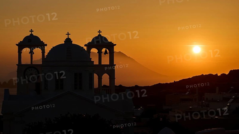Church, orthodox, Greek Orthodox church, Agios Nikolaos church, a church appears against an orange sunset with sea view and mountains, Trypiti, Tripiti, village, Milos, island, Cyclades, Greek islands, Greece