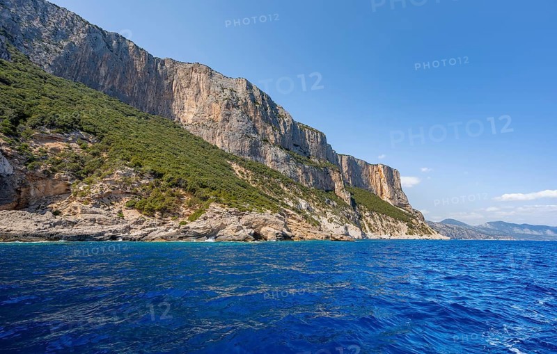 Picturesque rocky coast, cliffs and blue sea, Golfo di Orosei, Baunei, Sardinia, Italy
