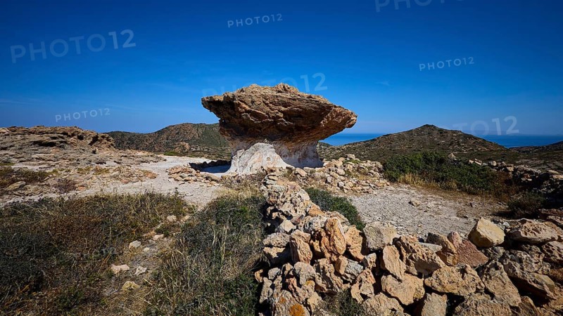 Rocky path leads through hilly landscape with distinctive rocks, mushroom rocks, mushroom rock, bizarre rocks, rock formation, Skiadi, Kimolos, Cyclades, Greek Islands, Greece