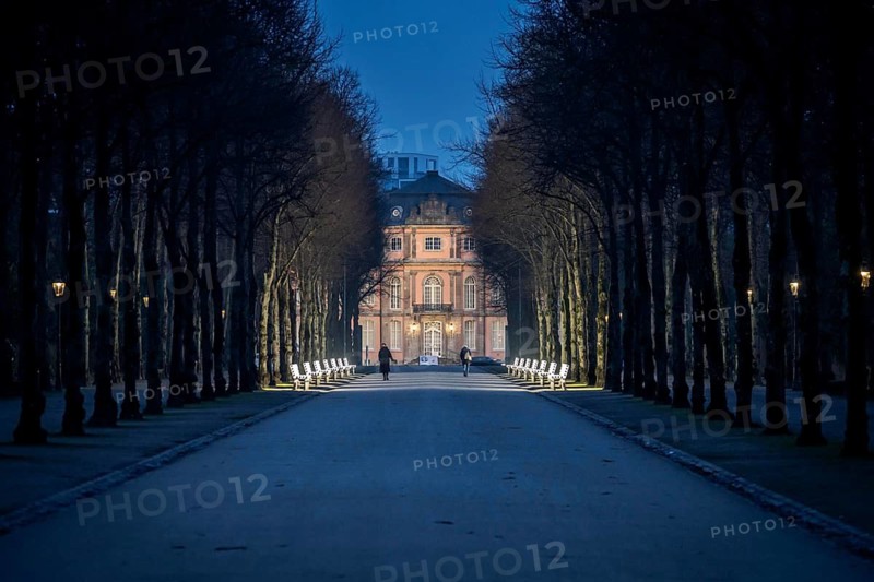 The light benches by artist Stefan Sous in the Hofgarten, entitled UV-A UV-B, 14 completely refurbished exhibits from the 2002 light-grey art exhibition, which now stand and light up as a permanent work of art on Jägerhofallee, LED technology, in the background Jägerhof Palace, home of the Goethe Museum, Düsseldorf, North Rhine-Westphalia, Germany