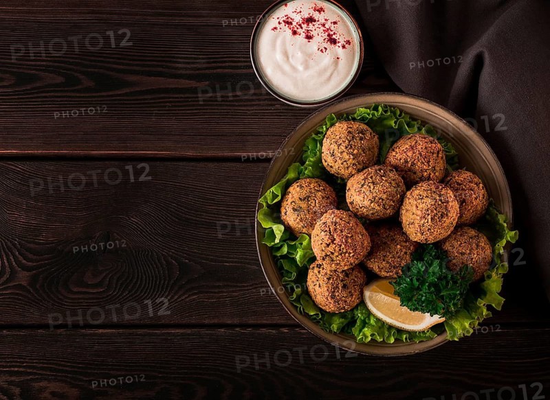 Chickpea falafel balls, on a wooden table, close-up, vegetarian food