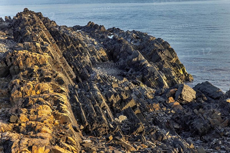 Gråhuken, Grey Hook, Cape Nud, Devonian-age Old Red Sandstone rock formations in the northernmost point in Andrée Land, Svalbard, Spitsbergen