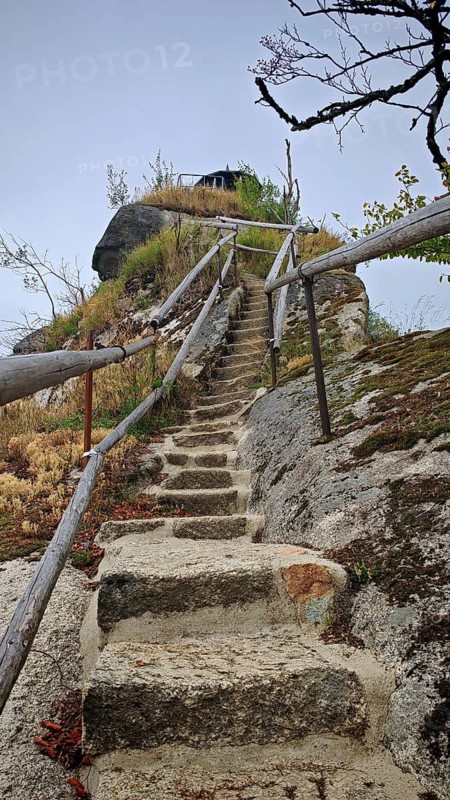 Narrow stone staircase with wooden railings leads steeply to a rocky viewpoint on Großer Waldstein, Fichtelgebirge nature park Park, Upper Franconia