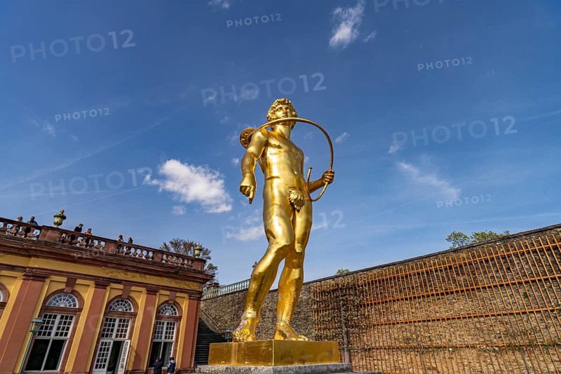 Golden statue of the luhrenblower at the orangery of Weilburg Castle, Hesse, Germany