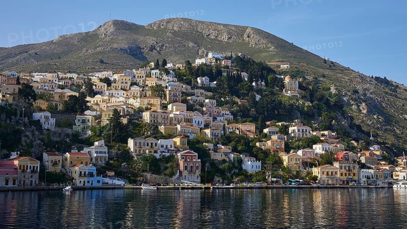 Hilly coastal town with colourful houses, Symi Town, Symi, Dodecanese, Greek Islands, Greece