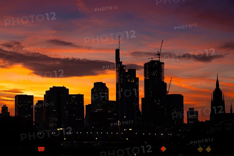 The silhouette of Frankfurt's banking skyline stands out against the luminous evening sky in the evening after sunset., Frankfurt am Main, Hesse, Germany