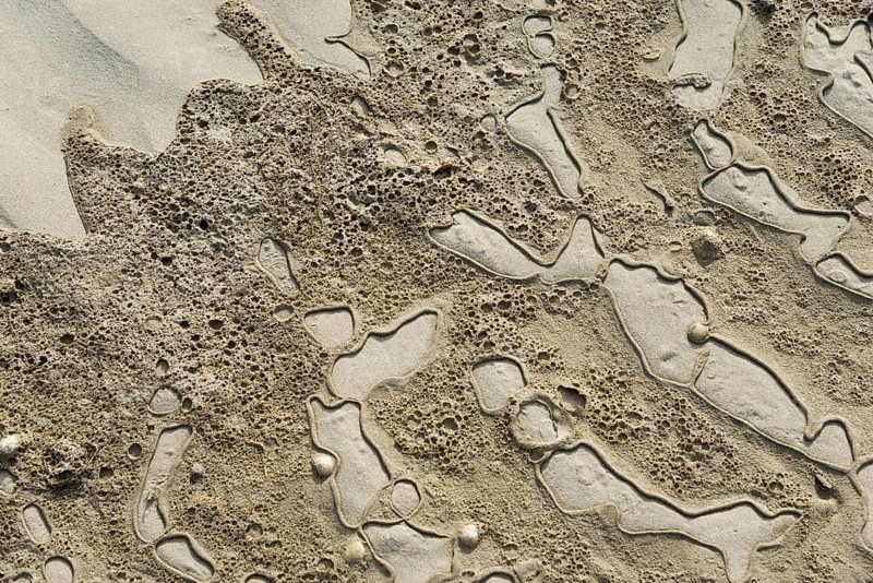 Textured sand surface with natural patterns and depressions, Plage Saint Efflamm, Plestin-les-Grèves, Breton Plistin, Arrondissement Lannion, Côtes-d'Armor, Brittany, France