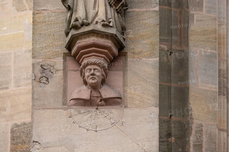 Portrait of the master builder Nikolaus Eseler under the statue of St George, 17th century, on the outer choir of St George's Church, Dinkelsbühl, Bavaria, Germany