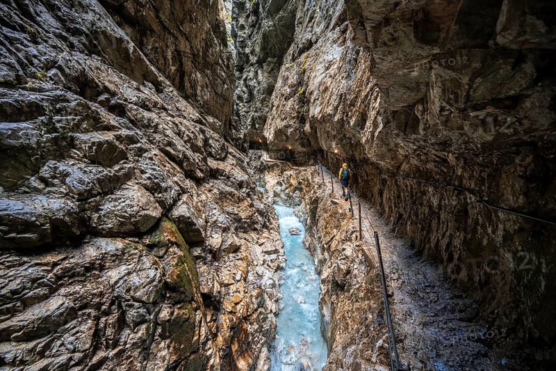 Hiker in a gorge, Hammersbach flows through Höllentalklamm, near Garmisch-Partenkirchen, Werdenfelser Land, Upper Bavaria, Bavaria, Germany