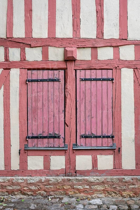 Detailed view of a historic half-timbered house with closed shutters in the old town of Troyes, Aube department, Grand Est region, France