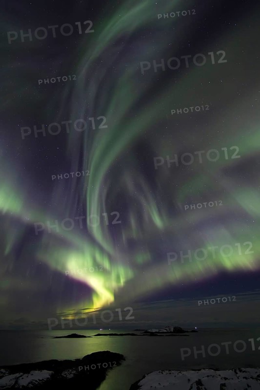 Northern Lights (Aurora borealis) in green and pink over the North Sea, Andøya, Vesterålen, Norway