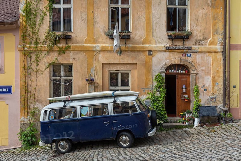 One van Volkswagen Bulli T2 standing in front of the Lazy River Hostel in Loket, Czech Republic