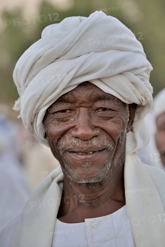 Portrait of a dervish in front of the Hamed al-Nile grave, at the weekly dervish ceremony, Hamed al-Nile cemetery, Kharthoum, Sudan