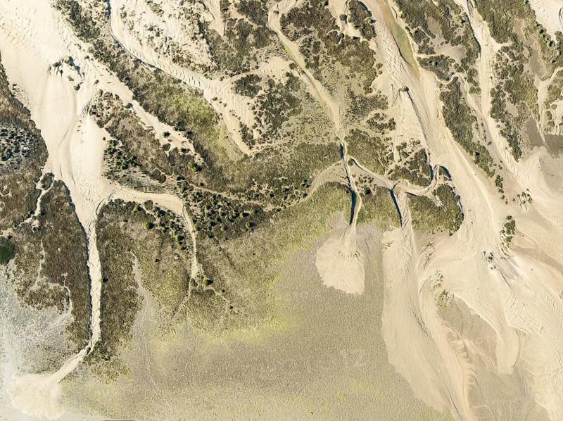 Sandy drifts at low tide at the Lago de la Gaviota (lake of the seagull). Aerial view. Drone shot. Isla Cristina, Huelva province, Andalusia, Spain