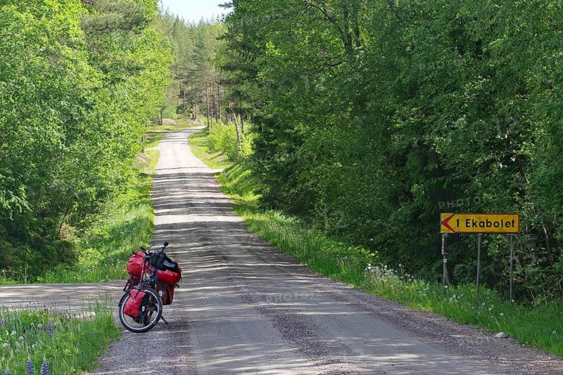 Bicycle parked on remote road in forest, Götaleden, Forsvik, Västra Götalands län, Sweden