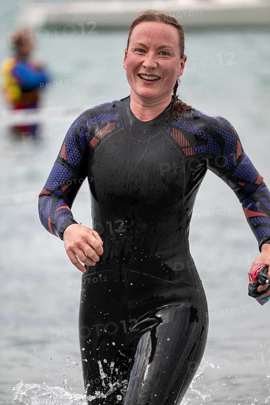 Sportswoman, swimmer comes out of the water after the swimming stage, Tegernsee Triathlon, Tegernsee, Upper Bavaria, Bavaria, Germany