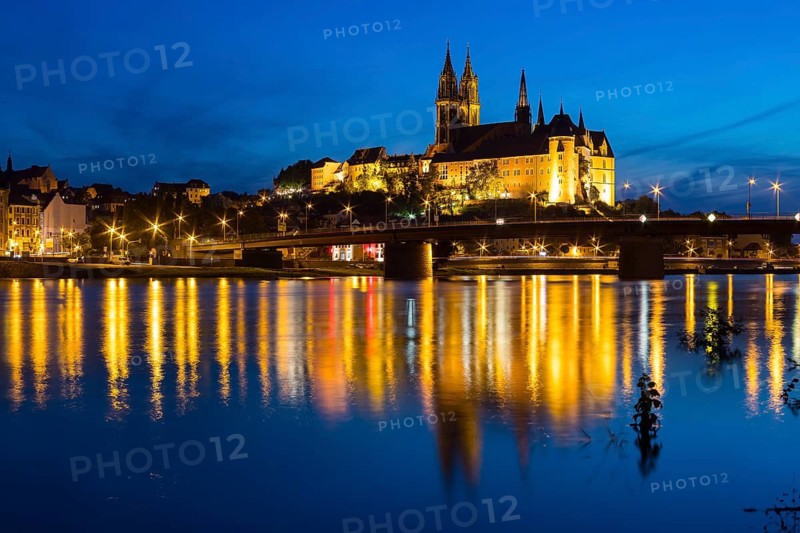 City view with Albrechtsburg castle, cathedral, Elbe river and old Elbe bridge at blue hour, Meissen, Saxony, Germany