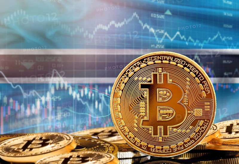 Investors in cryptocurrency and Blockchain Technology in Botswana, Concept. Bitcoin with Botswanan flag in the background