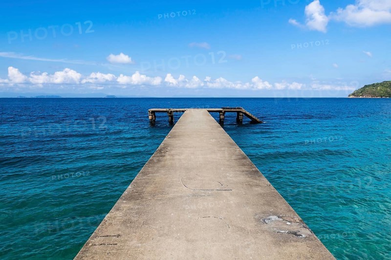 Small broken jetty on a tropical island in the marine park. Malaysia