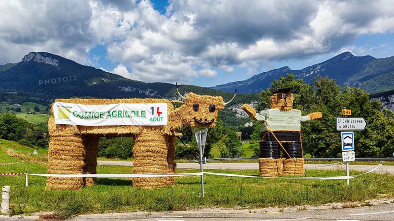 Two funny straw dolls made of bales of straw, figures, farmer, farmer with cow, Savoie, Auvergne-Rhone-Alpes, France