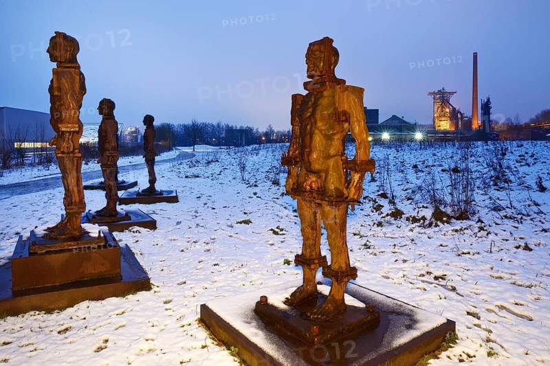People made of iron, multi-part iron sculpture by Zbigniew Fraczkiewicz in front of the Henrichshütte in winter, Hattingen, Ruhr area, Germany