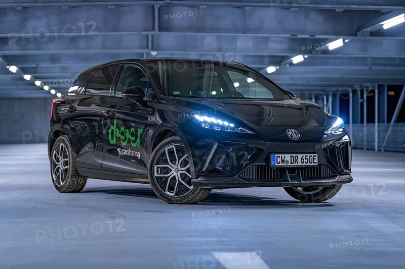 Black car in an illuminated multi-storey car park at night, e-car sharing, Deer Mobility, MG4, Calw, Germany