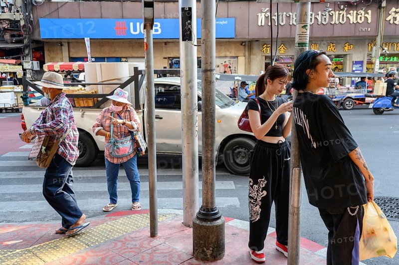 Bangkok, Thailand. February 18th 2025. Young and old, modern and traditional along Yaowarat Road, Chinatown, Bangkok, Thailand