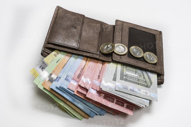 Wallet full of money, symbolic photo income, prices, economy, finances