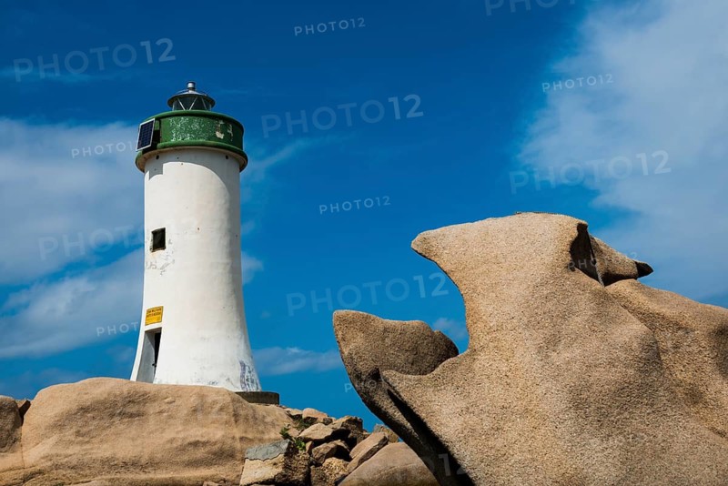 Lighthouse and bizarre granite rocks, Spiaggia Porto Faro, Faro di Punta Palau, Palau, Costa Smeralda, Sardinia, Italy