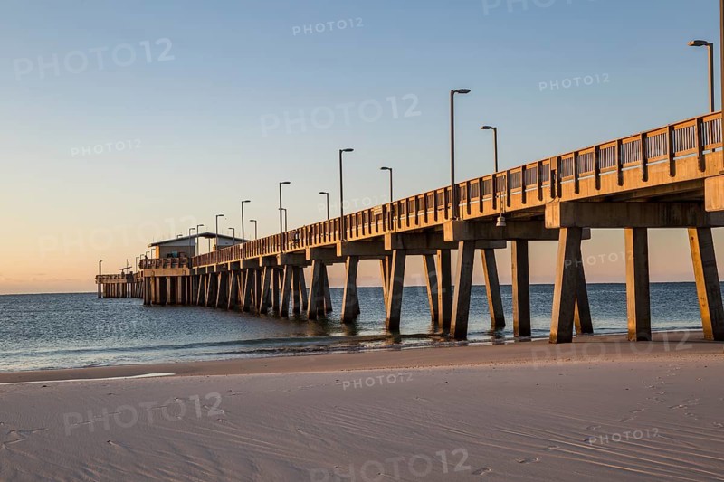Gulf State Park fishing pier at dawn on the beach of Gulf Shores, Alabama