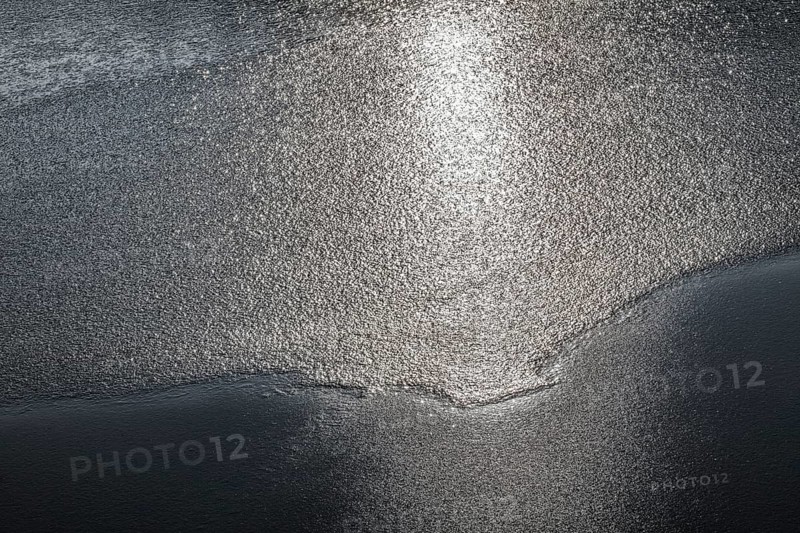 Frozen lake, structures of the water surface