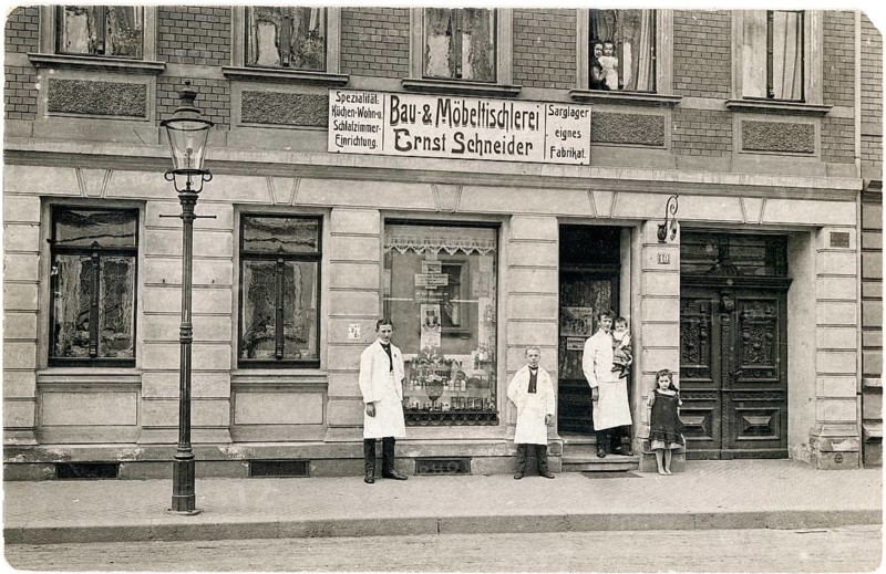 Furniture carpentry, Ernst Schneider, bedrooms, kitchens, shop, work, twenties, men standing in white coats in front of a building and furniture joinery shop, a child with a doll, around 1924