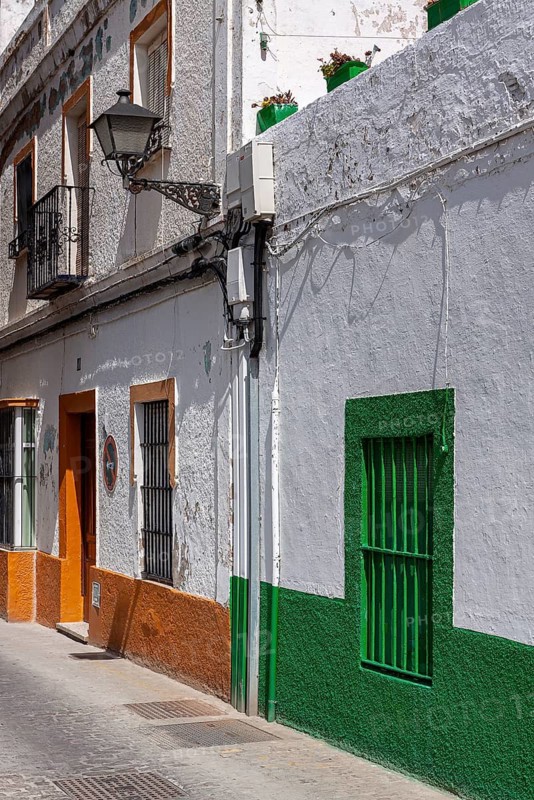 Small alley with colourful house facades, Rota, Andalusia, Spain