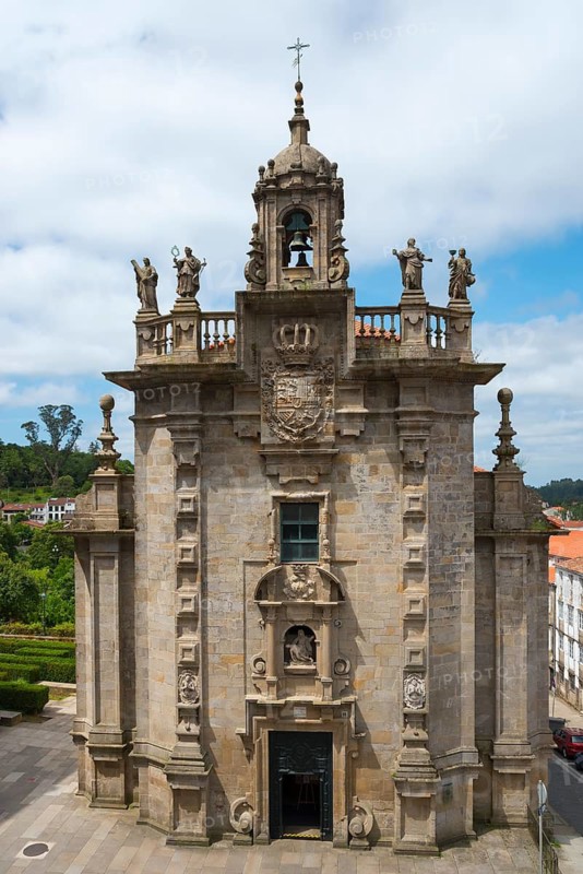 Baroque church with imposing bell tower and decorative sculptures against a cloudy sky, Iglesia de San Frutuoso, iglesia de las Angustias de Abajo, iglesia de la Real Angustia, in Galician: Igrexa de San Froitoso, church, Santiago de Compostela, autonomous community of Galicia, place of pilgrimage, destination of the Way of St James, Spain