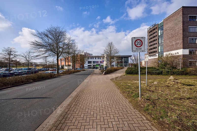 Zone 20 sign, town hall, trees, concrete pavement, asphalt road, blue sky with cumulus clouds, town hall square, Garbsen, Hanover region, Lower Saxony, Germany