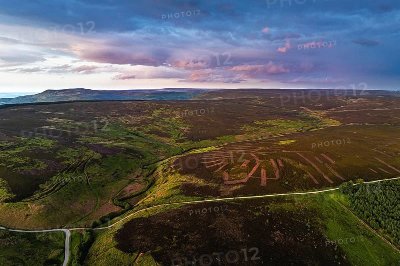 Sunset over Cod Beck Reservoir from a drone, North York Moors National Park, North Yorkshire, England, United Kingdom