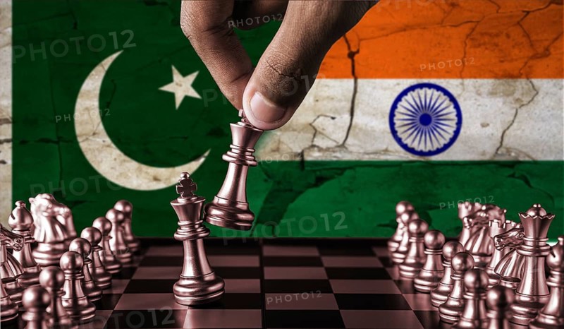 India vs Pakistan flag concept on chessboard. War between Pakistan and India. Conflict between Pakistan and India on pieces of chessboard