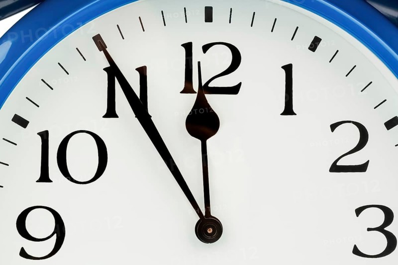 A blue alarm clock shows 5 in front of 12, Vienna, Austria