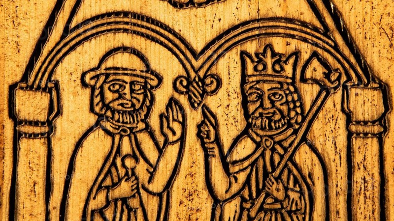 Pilgrim and Olav the Saint or Olav II Haraldsson with axe, wooden plaque on door with engraving, on a wooden door, pilgrim hostel Arteid Vestre Gård, Norway