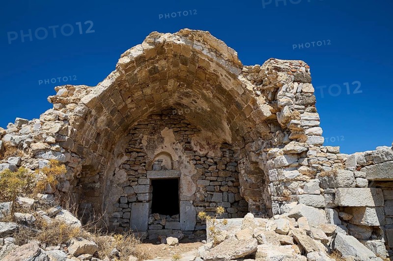 Dilapidated stone buildings under clear blue sky, remains of an old construction, Johanniter fortress from the 14th century AD, fortress of Megalo Chorio, Kastro, Megalo Chorio, Zero Waste Island, Tilos, Dodecanese, Greek Islands, Greece