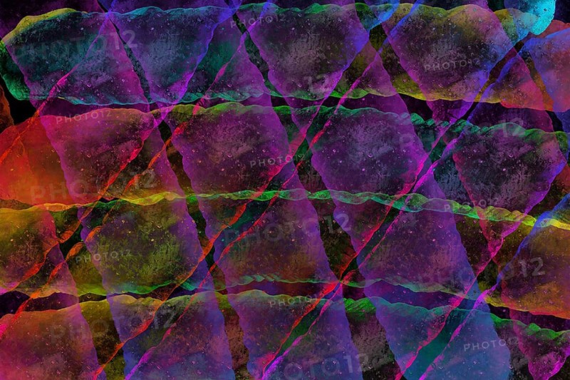 Vibrant abstract image featuring overlapping vivid colors, creating dynamic and textured patterns. The interplay of red, blue, green, and purple evokes depth and motion