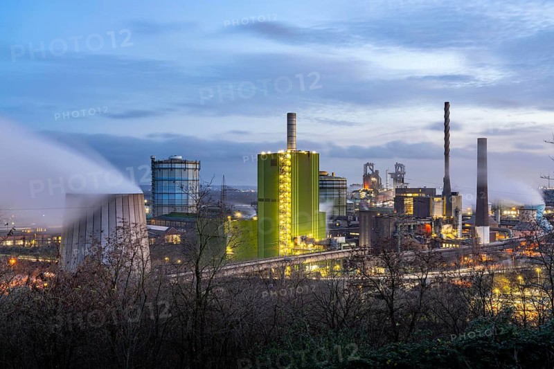 Panorama of the Thyssenkrupp Steel steelworks in Duisburg-Bruckhausen, in front the gas-fired power plant Hamborn, green facade of the boiler house Block5, in the centre the blast furnaces 8 and 9, North Rhine-Westphalia, Germany