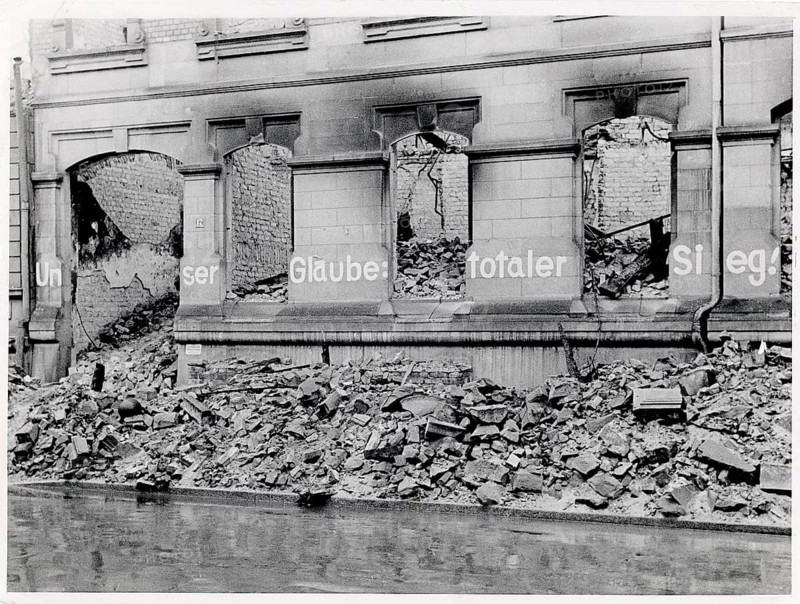 Cologne, ruin, residential building, end of war Graffitti, Our Faith, total war, fascism, World War II, National Socialism, façade of a destroyed building with broken out windows and rubble, 1945