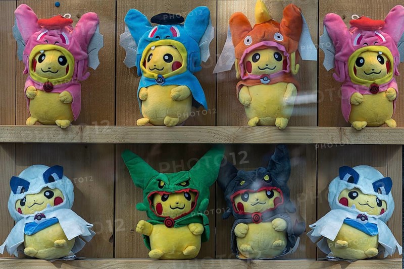 Pokémon figures with various masks in a shop window, Enschede, the Netherlands