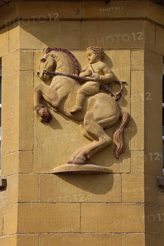 Stone portrait, boy on horse, stone relief on building, rearing horse with rider, sculpture, statue, stone figure, sculptor's work, Wiesensteig, Filstal, Baden-Württemberg, Germany
