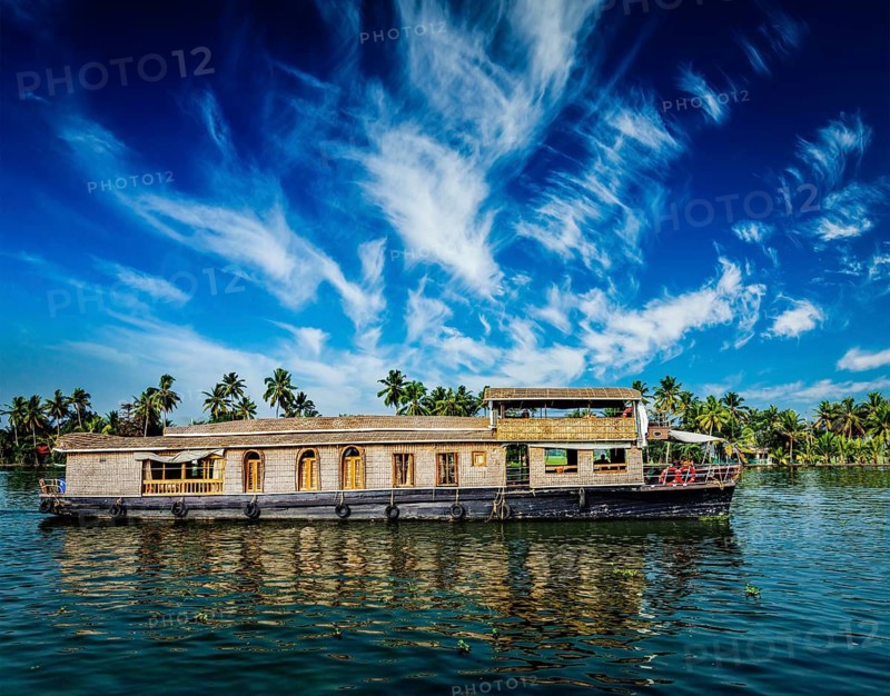 Kerala India travel background, houseboat on Kerala backwaters. Kerala, India